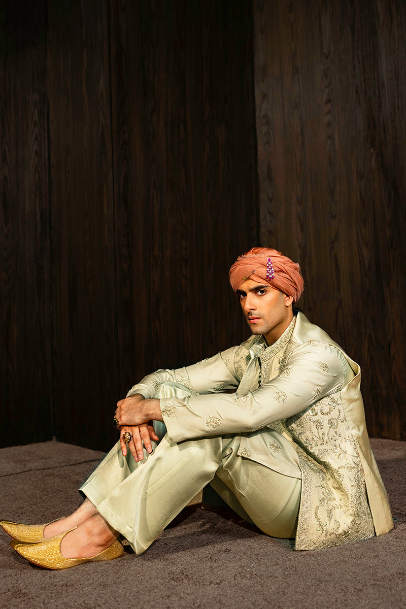 Designer pastel green kurta with waistcoat available online in Pakistan, featuring intricate embroidery and premium fabric, perfect for festive and formal occasions.