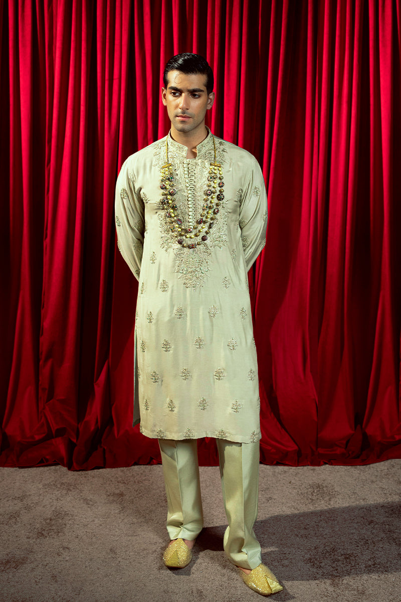 Designer pastel green kurta with waistcoat available online in Pakistan, featuring intricate embroidery and premium fabric, perfect for festive and formal occasions.