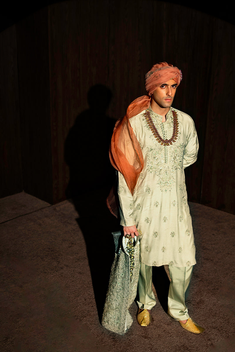 Designer pastel green kurta with waistcoat available online in Pakistan, featuring intricate embroidery and premium fabric, perfect for festive and formal occasions.